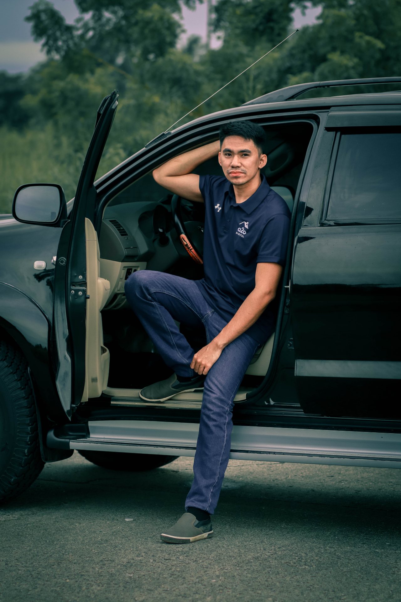 Christian Lugatiman seated in a pickup truck